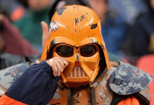 DENVER - OCTOBER 7: A fan of the Denver Broncos wipes tears from his darth vader helmet during the game against the San Diego Chargers at Invesco Field at Mile High October 7, 2007 in Denver, Colorado. The Chargers defeated the Broncos 41-3. (Photo by Doug Pensinger/Getty Images)